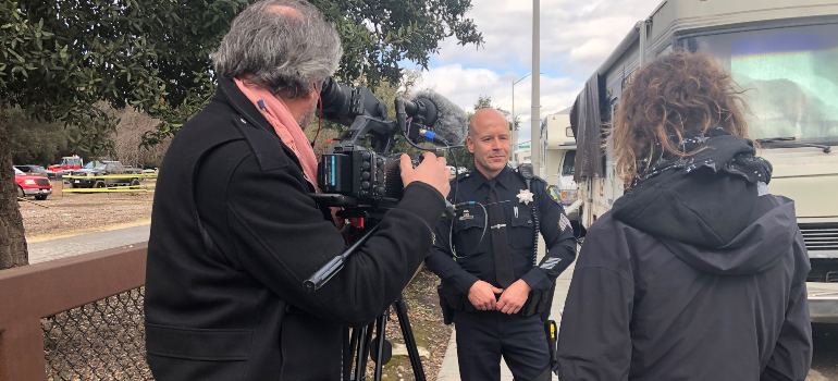 Officer being interviewed by media partners